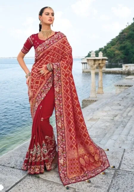 Maroon pure bandhej pallu and dola silk with zari, moti and heavy mirror work