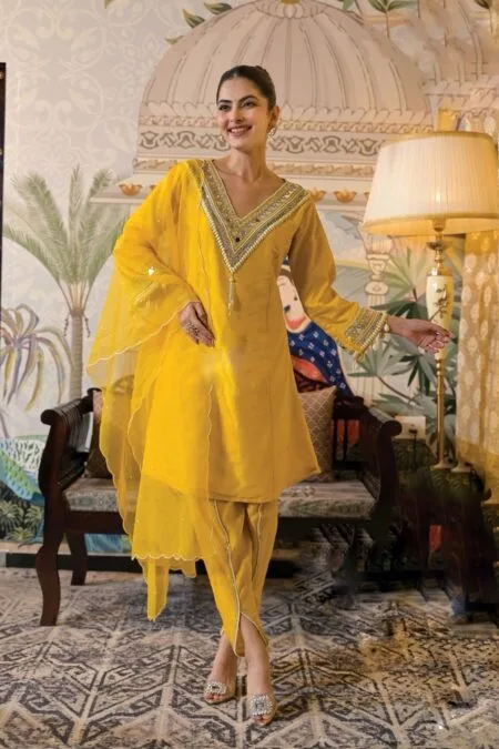 Yellow dhoti style pant and kurta set with dupatta with embroidered mirror work and tassels