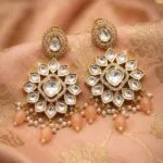 Carat plated Kundan earrings with orange/ peach beads