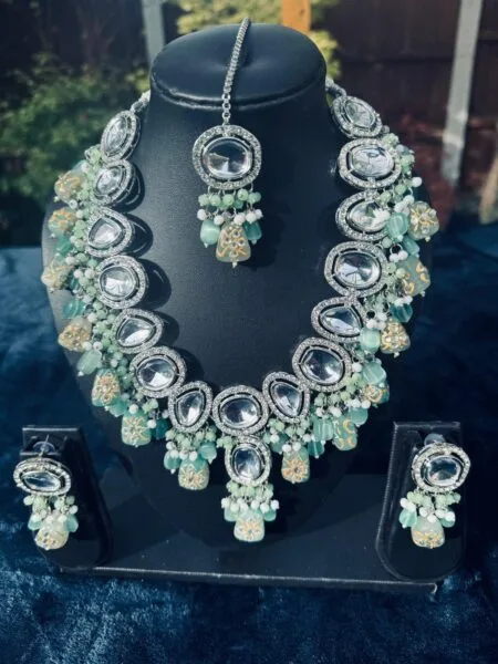 Silver Kundan and mint green beaded necklace set with Maang tikka