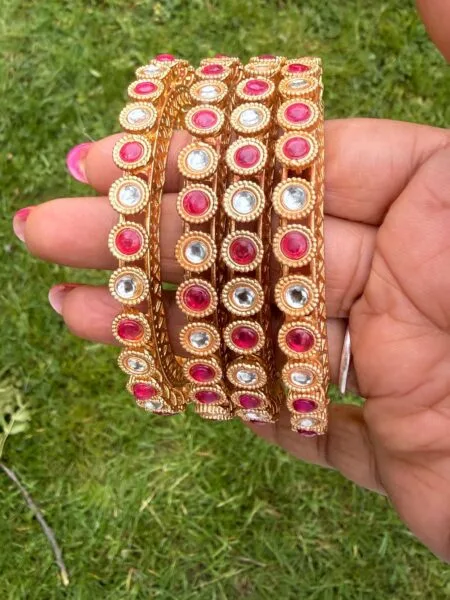 Pink stone and white stone antique gold 
Bangles