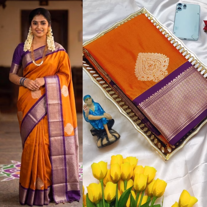 Traditional Korvai silk saree in vibrant orange with purple contrast pallu, gold woven motifs, paired with matching blouse, ideal for weddings and cultural events.